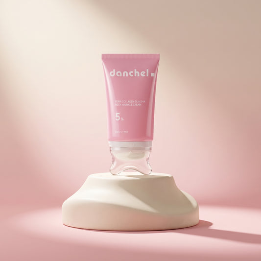 danchel PDRN Collagen Neck & Contour Cream – pink tube with built-in gua-sha applicator