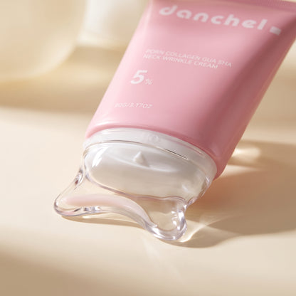 Close-up of danchel's built-in clear gua-sha massage applicator